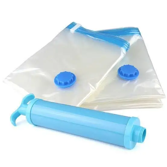 Travel Vacuum Bags with Hand Pump Two clear vacuum storage bags with blue seals and a light blue manual hand pump for travel.